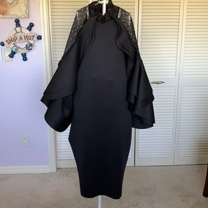 New black dress with very unique sleeves. A showstopper
